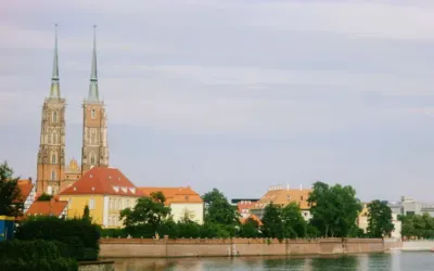 Scenic view of Wrocław Cathedral by the Oder River with historic architecture.